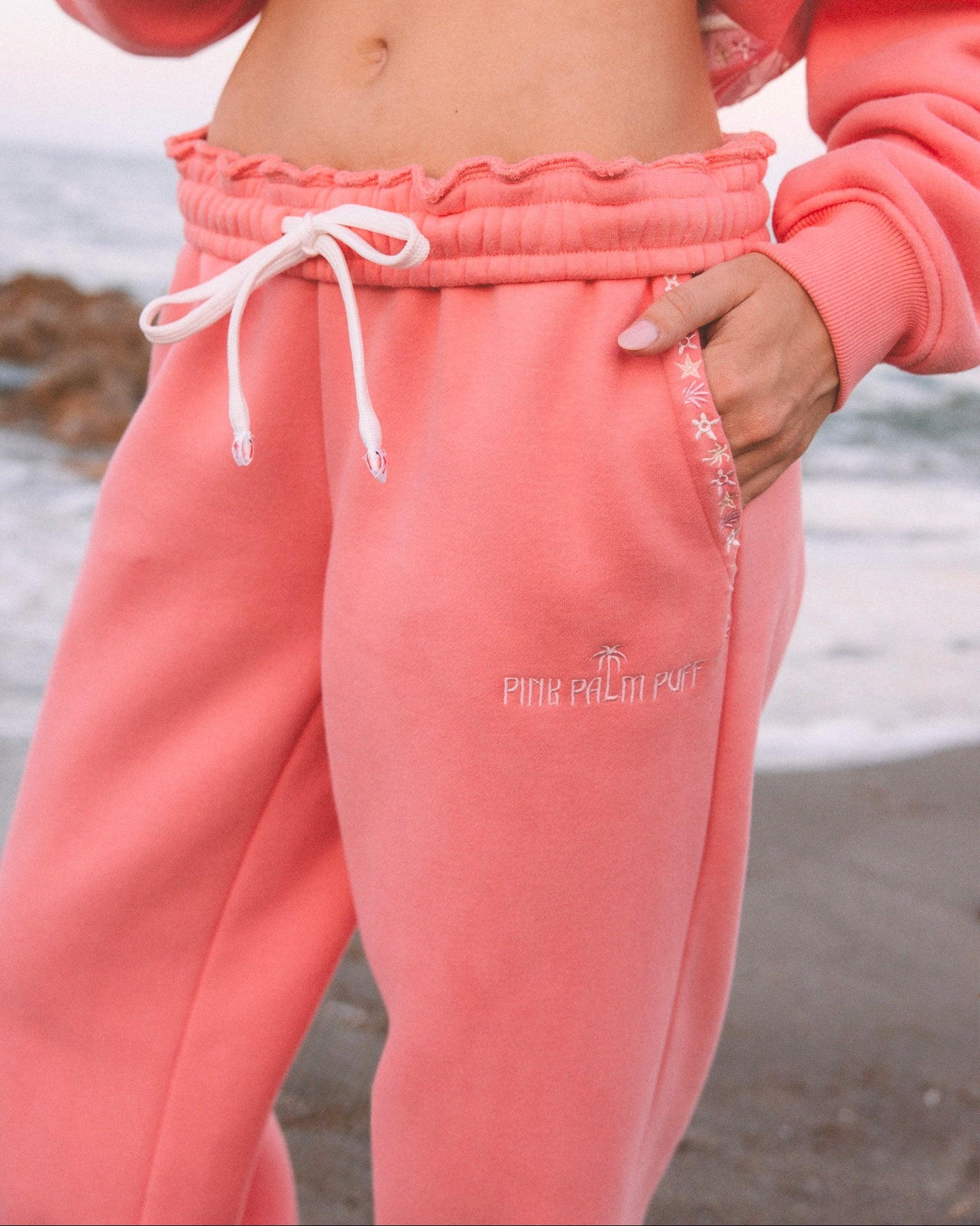 matching coral pink set, with pink palm puff pattern border
