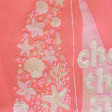 matching coral pink set, with pink palm puff pattern border
