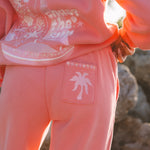 matching coral pink set, with pink palm puff pattern border
