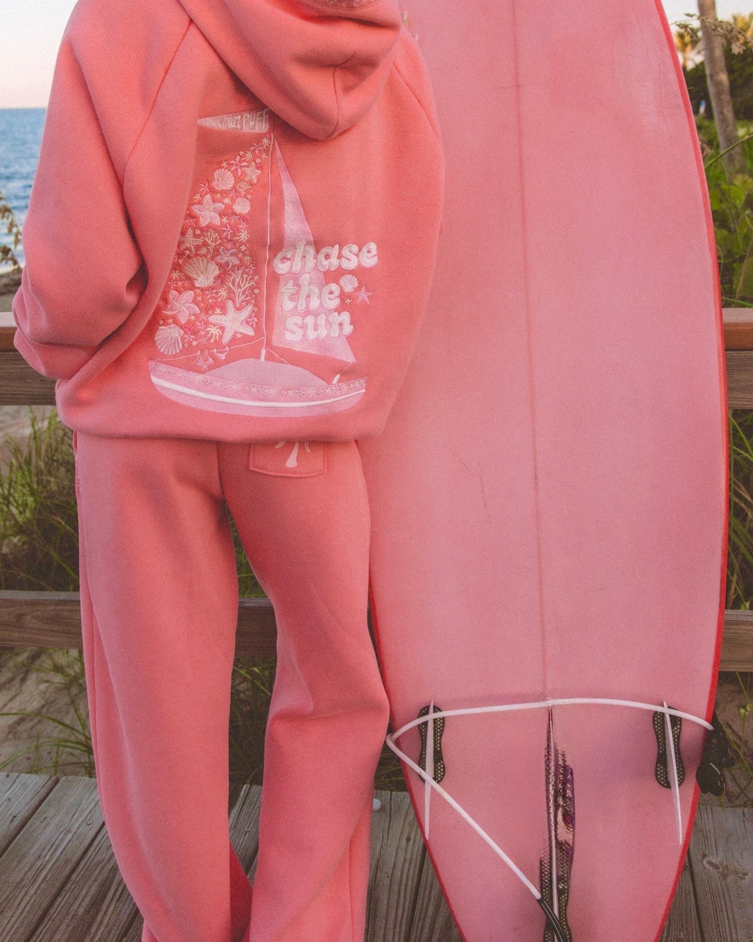 matching coral pink set, with pink palm puff pattern border