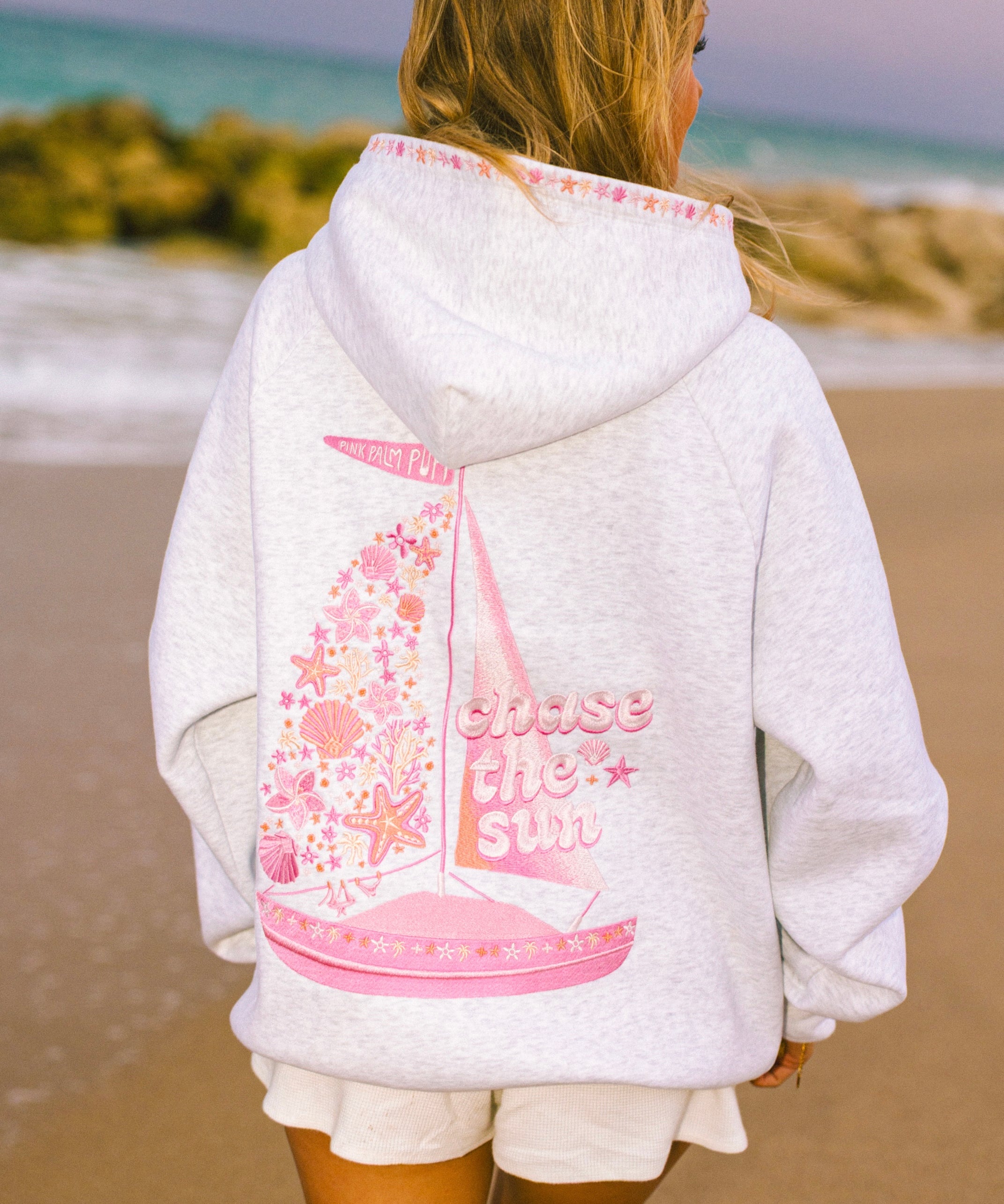 "Chase the Sun" Relaxed Hoodie, relaxed fit with an adjustable drawstring hood and pocket, in Heather Cloud - coastal preppy aesthetic beach style by Pink Palm Puff