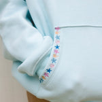 "Chase the Sun" Relaxed Hoodie, relaxed fit with an adjustable drawstring hood and pocket, in Sky Blue - coastal preppy aesthetic beach style by Pink Palm Puff