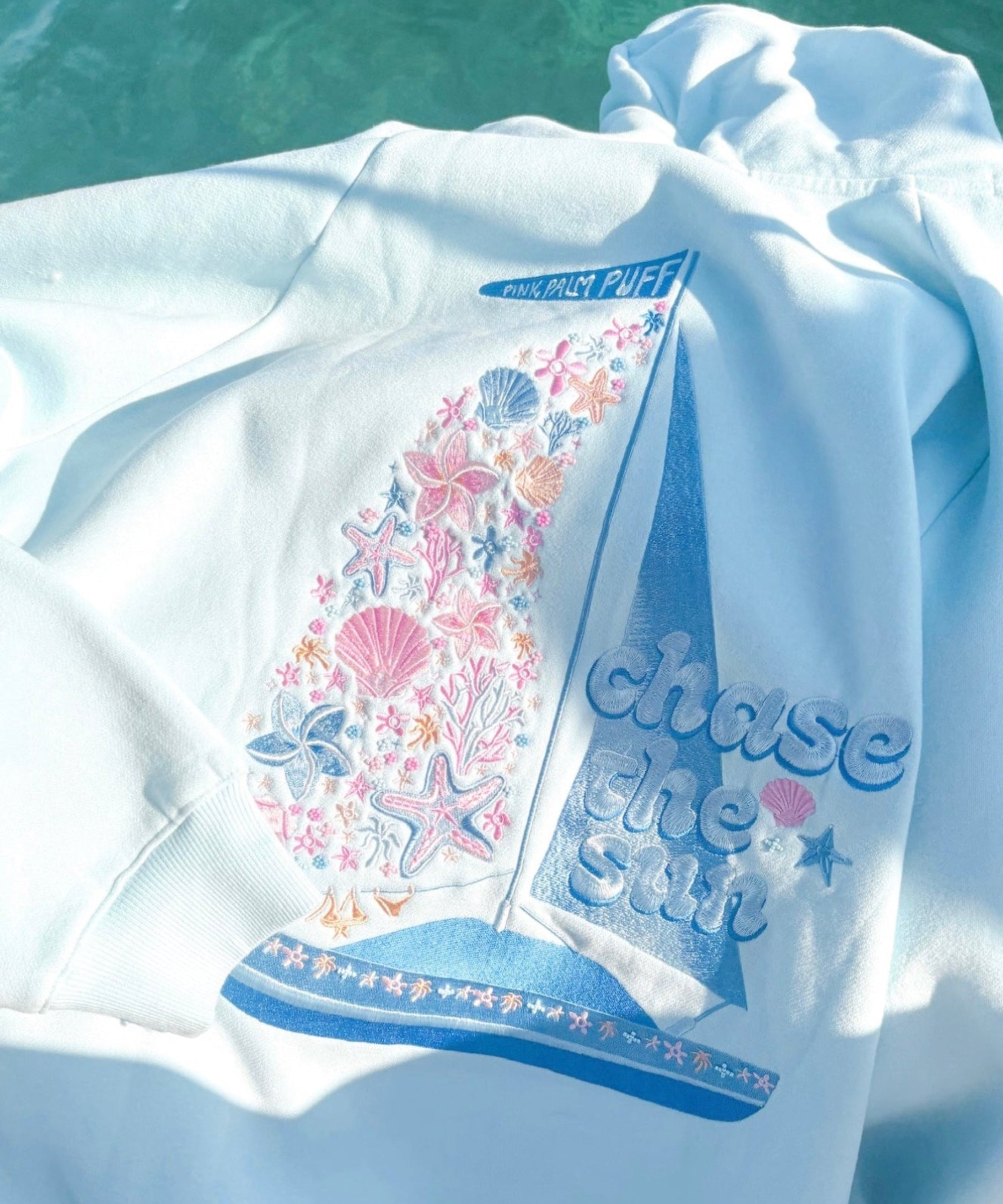 "Chase the Sun" Relaxed Hoodie, relaxed fit with an adjustable drawstring hood and pocket, in Sky Blue - coastal preppy aesthetic beach style by Pink Palm Puff