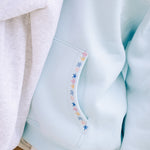 "Chase the Sun" Relaxed Hoodie, relaxed fit with an adjustable drawstring hood and pocket, in Sky Blue - coastal preppy aesthetic beach style by Pink Palm Puff