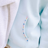 "Chase the Sun" Relaxed Hoodie, relaxed fit with an adjustable drawstring hood and pocket, in Sky Blue - coastal preppy aesthetic beach style by Pink Palm Puff