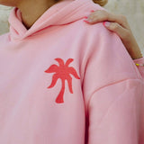 "Everything Comes in Waves" Hoodie in Pink by Pink Palm Puff