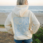 "Live in the Moment" Hoodie, adjustable drawstring hood and pocket, in Sand - coastal preppy aesthetic beach style by Pink Palm Puff